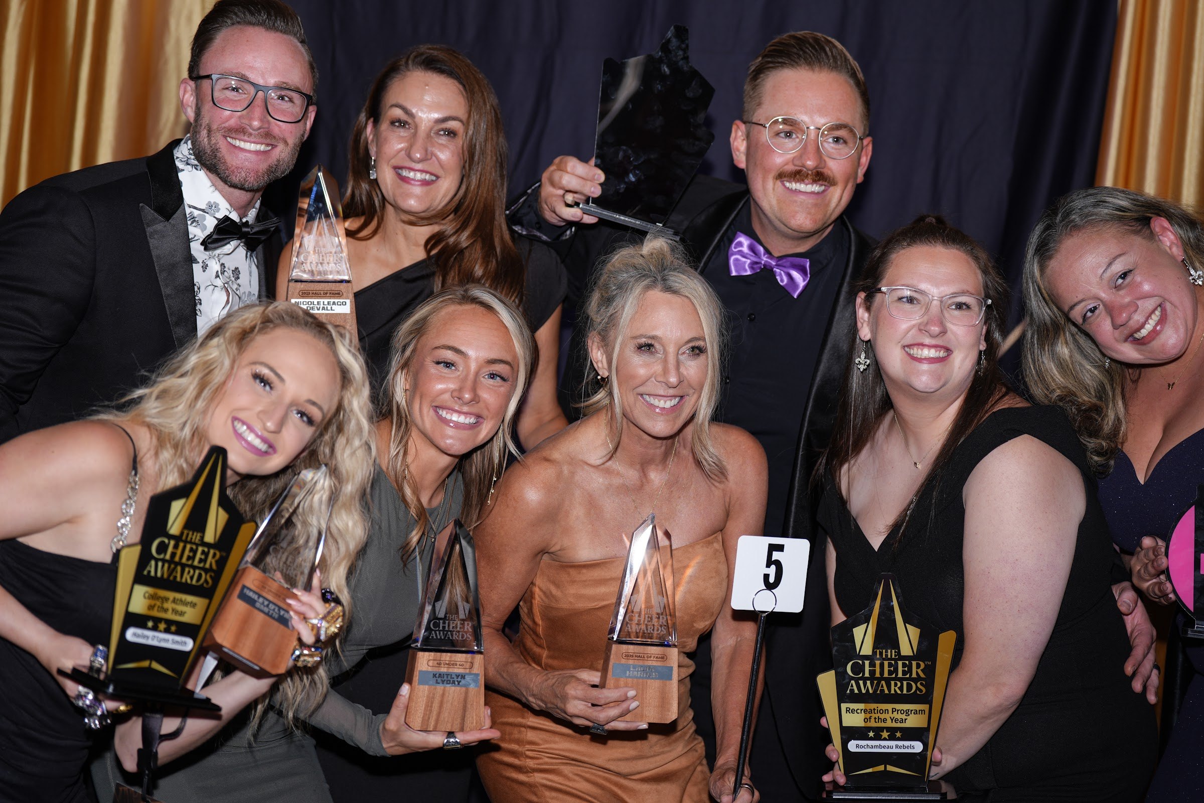 Honorees celebrating together with their trophies at The Cheer Awards 2026